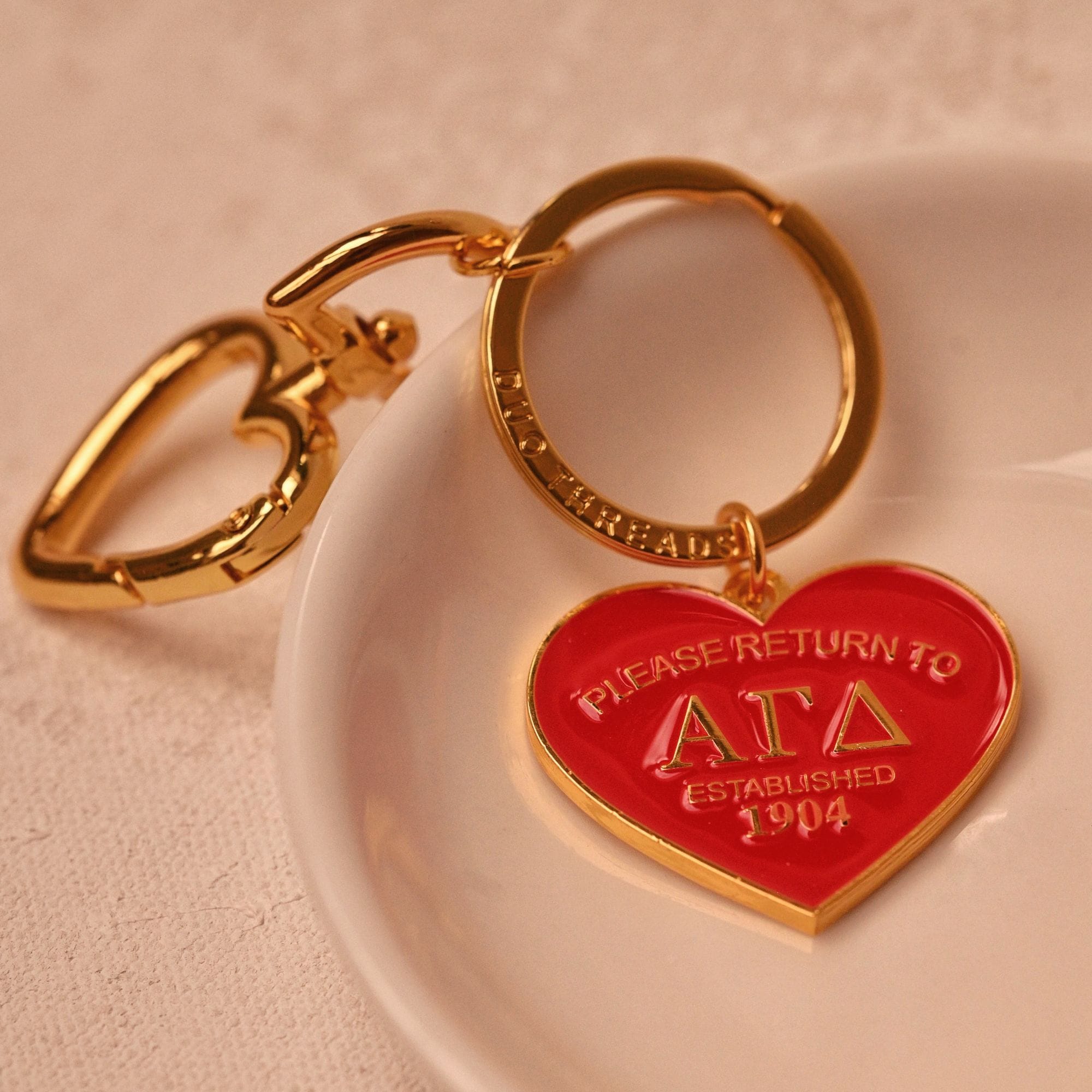 Return to Alpha Gamma Delta Keychain
