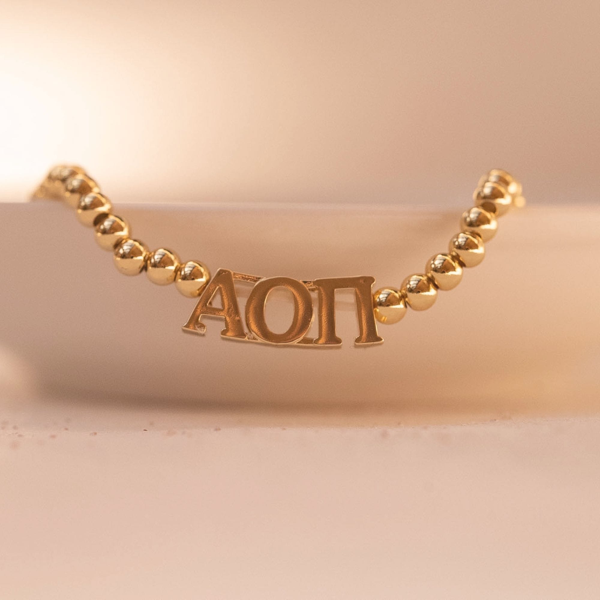 Alpha Omicron Pi Gold Beaded Bracelet